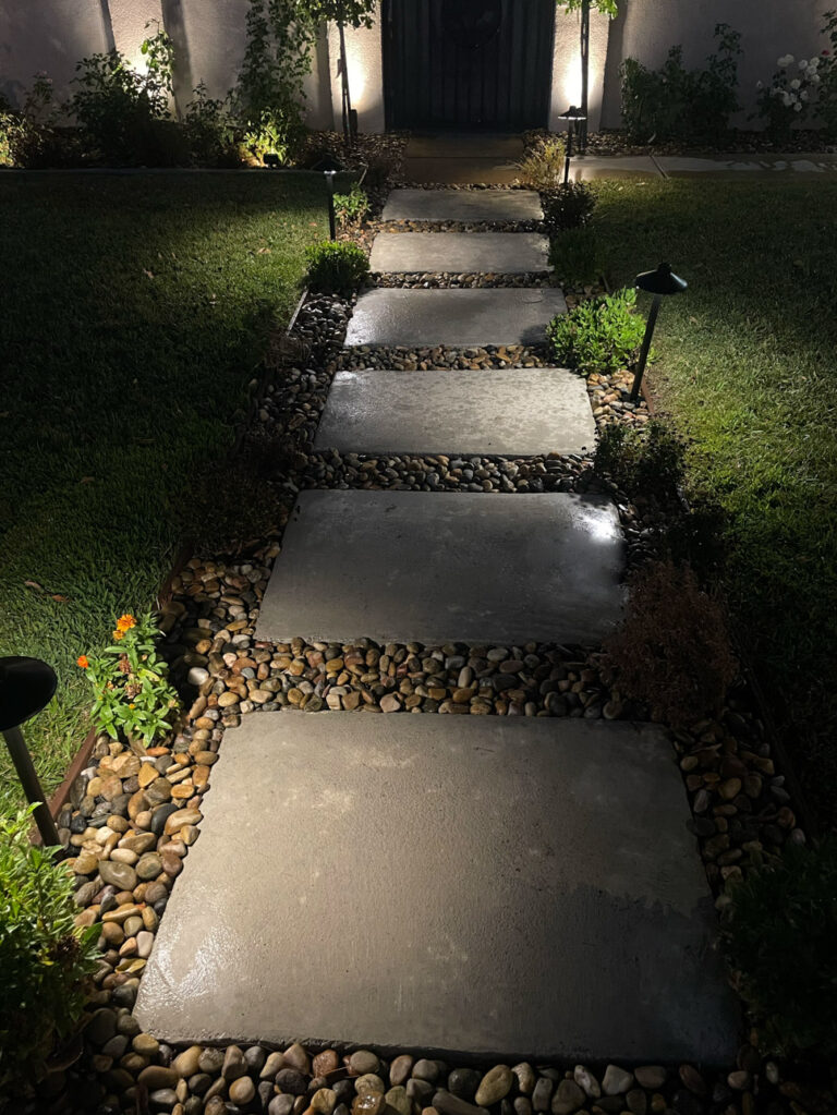 Pathway illuminated with outdoor landscape lighting